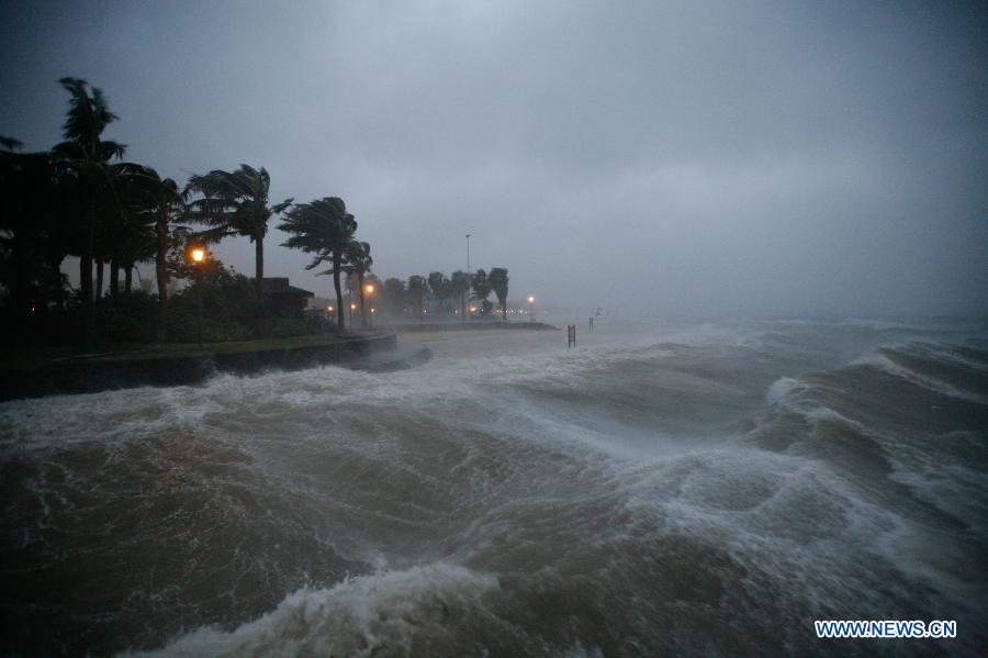 Photo taken on July 2, 2013 shows the surged waves stired up by the tropical storm Rumbia in Zhanjiang, south China's Guangdong Province. Tropical storm Rumbia landed on Zhenjiang on Tuesday morning and brought torrential rain and gales to some areas in Guangdong Province. (Xinhua/Liang Zhiwei)