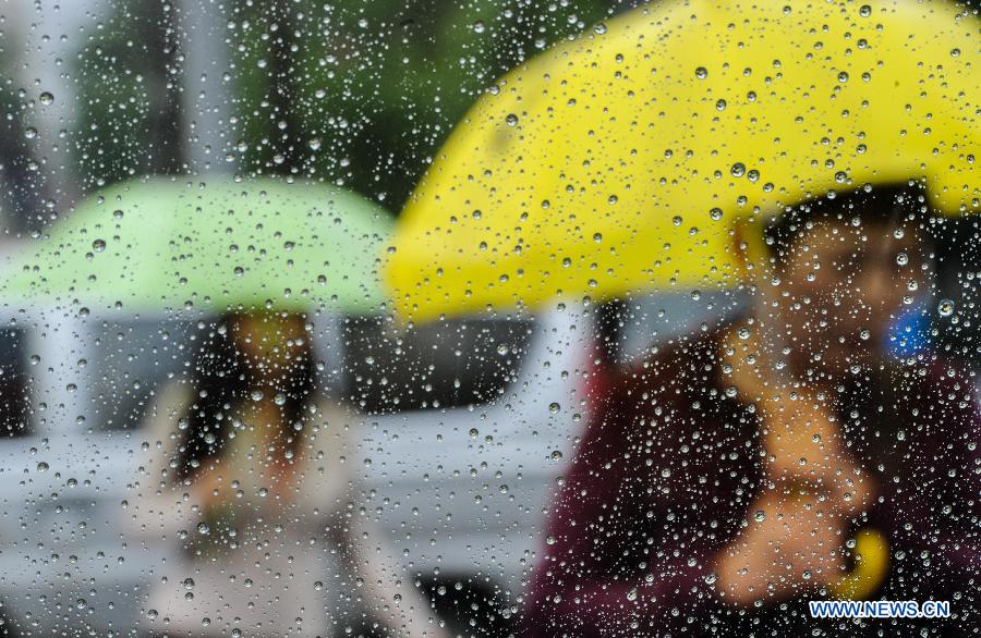 Rain drops are seen on a window in Changchun, capital of northeast China's Jilin Province, July 2, 2013. Heavy rain has hit Jilin in recent days. (Xinhua/Xu Chang)