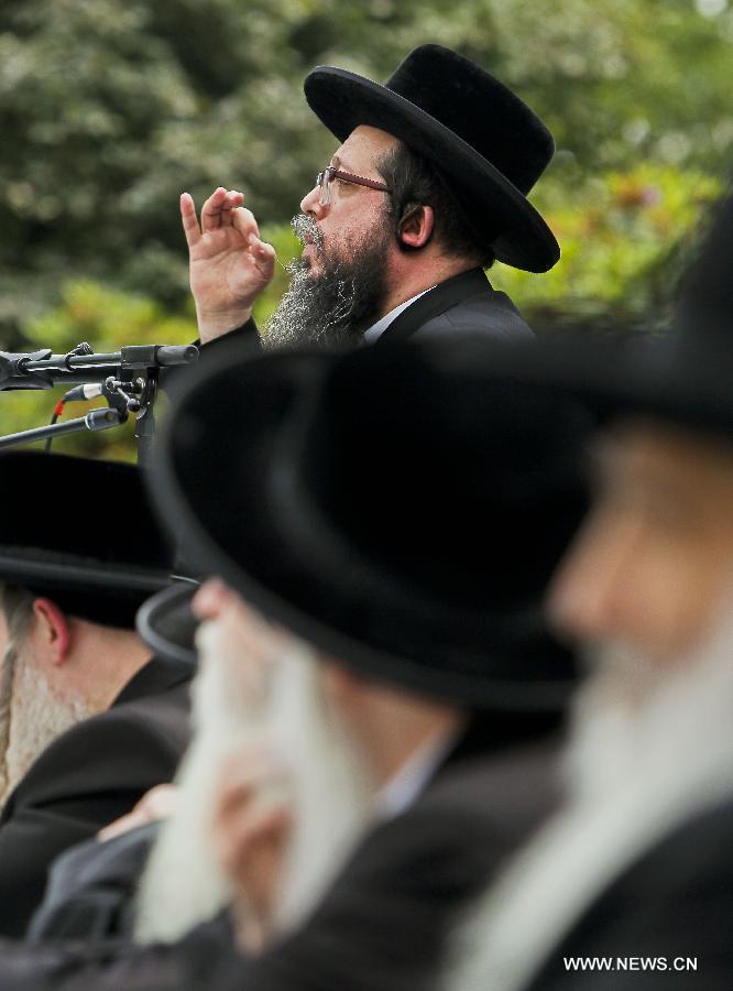 Representatives from the Orthodox Jewish communities of Austria, Belgium, Britain, France and other European countries take part in a rally outside the European Union headquarters in Brussels, capital of Belgium, July 1, 2013. Hundreds of Orthodox Jews on Monday took part in the rally to protest against a new Israeli draft legislation which requires the men from the Orthodox community in Israel to join the army at the age of 18. The protestors appealed to the EU to put pressure on Israel to change the legislation plan. (Xinhua/Zhou Lei) 