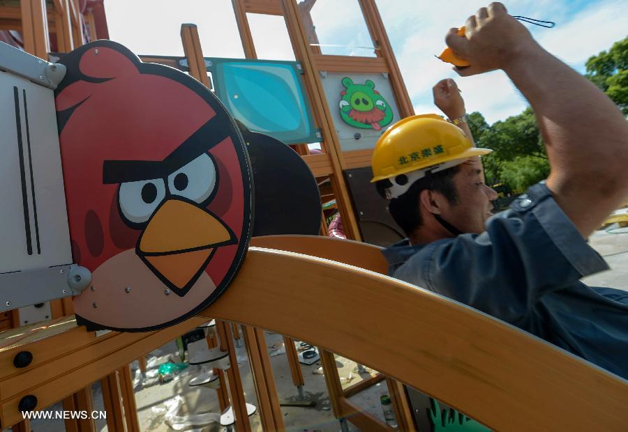 A worker is seen at an Angry Birds theme park in Haining, east China's Zhejiang Province, July 2, 2013. The Angry Birds theme park, the first of its kind in China, is under construction and is expected to open to the public in October. Angry Birds, created by the Finland-based Rovio Entertainment, is a popular game for smartphones and tablet computers. (Xinhua/Han Chuanhao) 