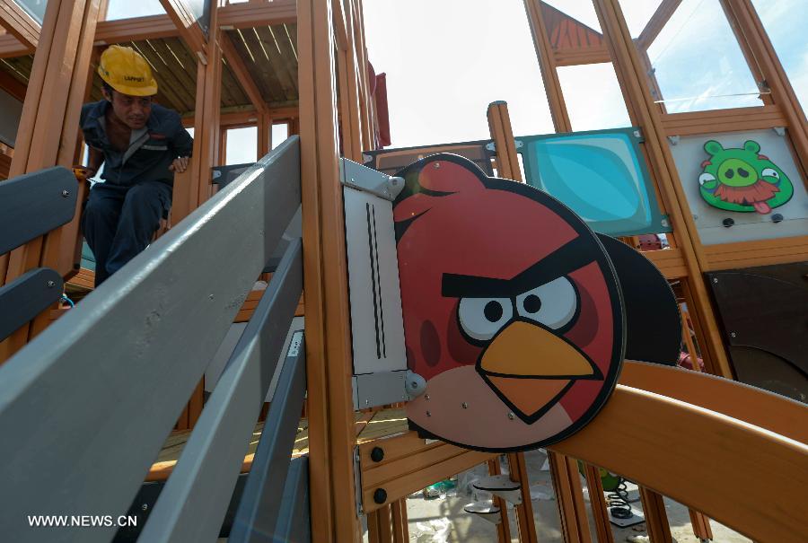 A worker is seen at an Angry Birds theme park in Haining, east China's Zhejiang Province, July 2, 2013. The Angry Birds theme park, the first of its kind in China, is under construction and is expected to open to the public in October. Angry Birds, created by the Finland-based Rovio Entertainment, is a popular game for smartphones and tablet computers. (Xinhua/Han Chuanhao)