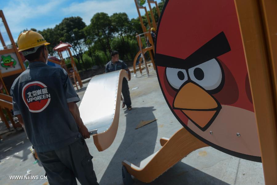 Workers work at an Angry Birds theme park in Haining, east China's Zhejiang Province, July 2, 2013. The Angry Birds theme park, the first of its kind in China, is under construction and is expected to open to the public in October. Angry Birds, created by the Finland-based Rovio Entertainment, is a popular game for smartphones and tablet computers. (Xinhua/Han Chuanhao) 
