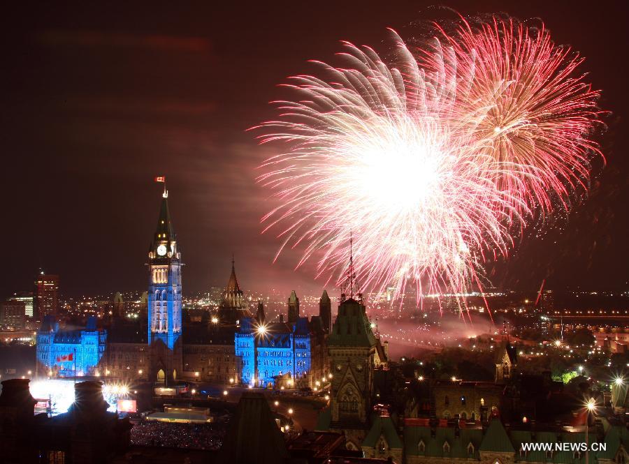 Fireworks are set off at Parliament Hill as a part of Canada Day celebrations in Ottawa, capital of Canada, on July 1, 2013. Celebrations were held across the country to mark the 146th anniversary of Canada's foundation. (Xinhua/Jodi Ellen Chamberlin) 