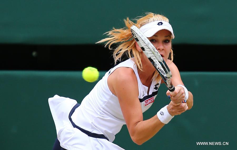 Agnieszka Radwanska of Poland returns the ball during the quarterfinal of women's singles against Li Na of China on day 8 of the Wimbledon Lawn Tennis Championships at the All England Lawn Tennis and Croquet Club in London, Britain on July 2, 2013. Agnieszka Radwanska won 2-1. (Xinhua/Yin Gang) 