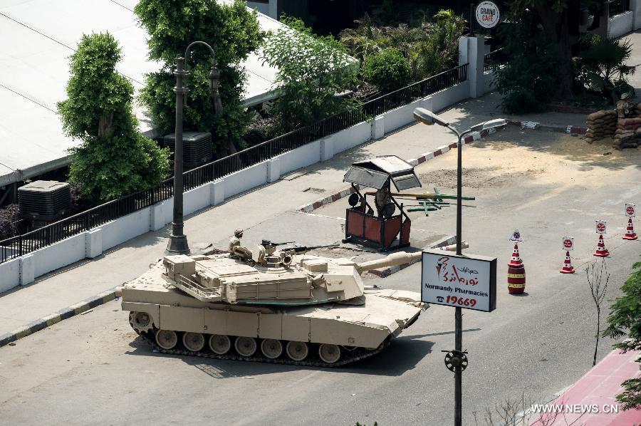A tank from Egyptian Army is seen deployed on the street in Cairo, Egypt, July 3, 2013. The chairman of Egypt's Supreme Constitutional Court will run the country for a transitional period, military chief said in a televised speech on Wednesday. (Xinhua/Li Muzi)