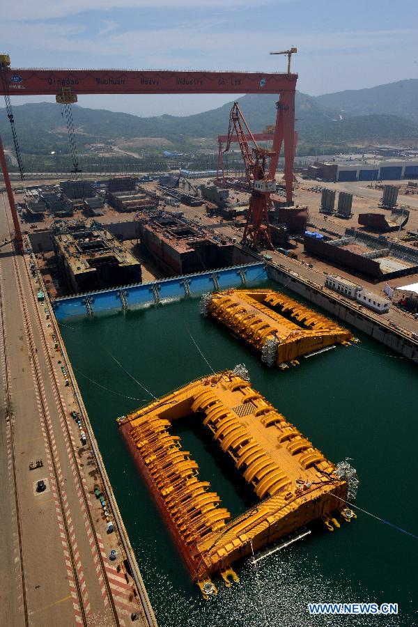 Photo taken on July 3, 2013 shows buoys of the newly-built deep-sea engineering equipment in Qingdao, east China's Shandong Province. (Xinhua/Wan Houde)