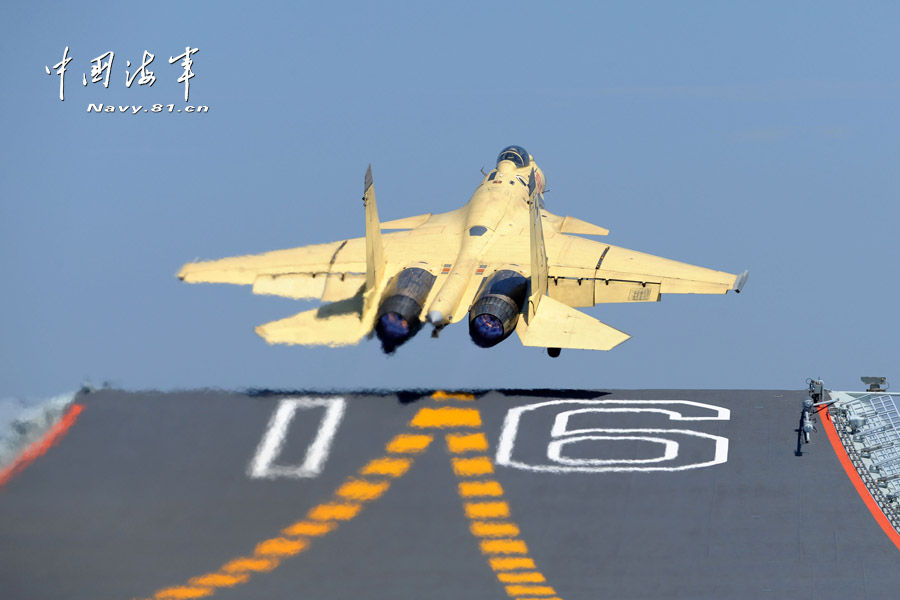 Photo shows a J-15, China's first-generation multi-purpose carrier-borne fighter jet, taking off from the deck of the Liaoning, China's first aircraft carrier, on June 29, 2013. (Source: people.com.cn)