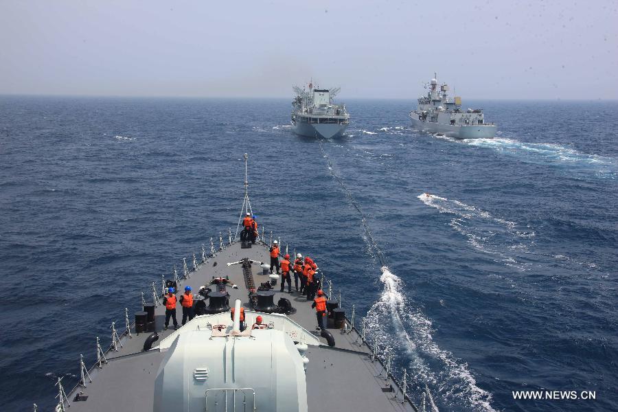 The destroyers Shenyang, Shijiazhuang and comprehensive supply ship Hongze Lake are seen during Sino-Russian joint naval drills held in the sea of Japan, July 4, 2013. (Xinhua/Wu Dengfeng) 
