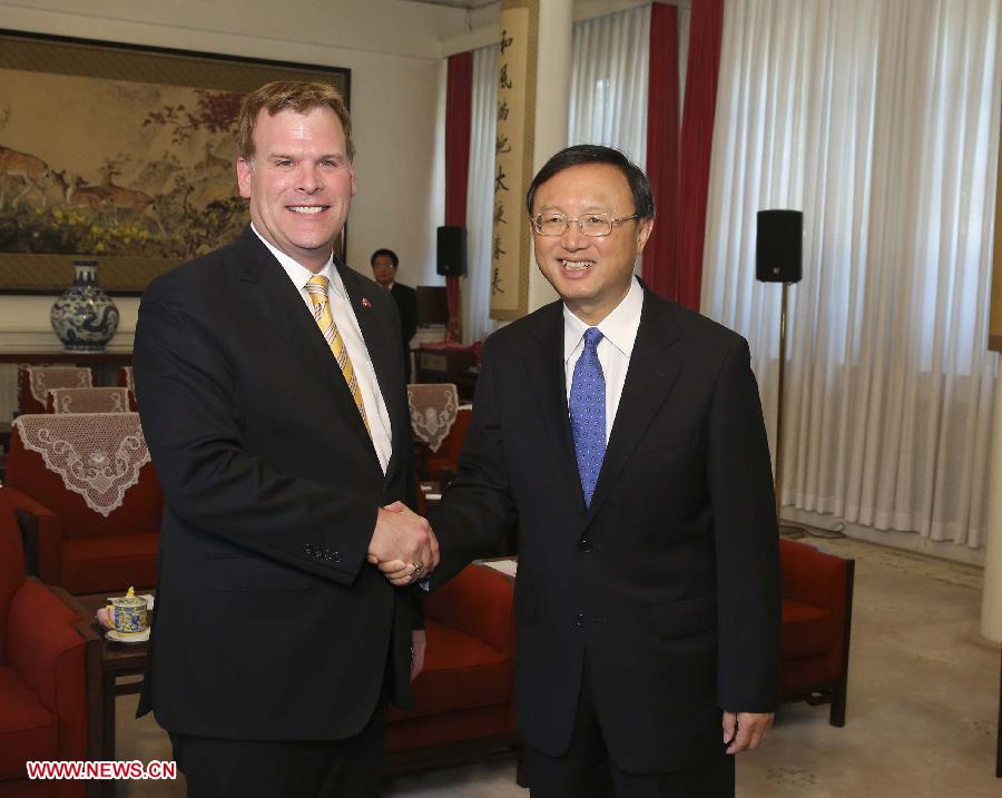 Chinese State Councilor Yang Jiechi (R) meets with Canadian Foreign Minister John Baird in Beijing, capital of China, July 4, 2013. (Xinhua/Ding Lin)