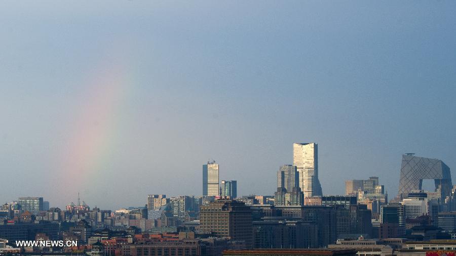 Photo taken on July 4, 2013 shows a rainbow after a shower in Beijing, capital of China. Beijing witnessed a shower at the dusk on Thursday. (Xinhua/Wu Kaixiang)  
