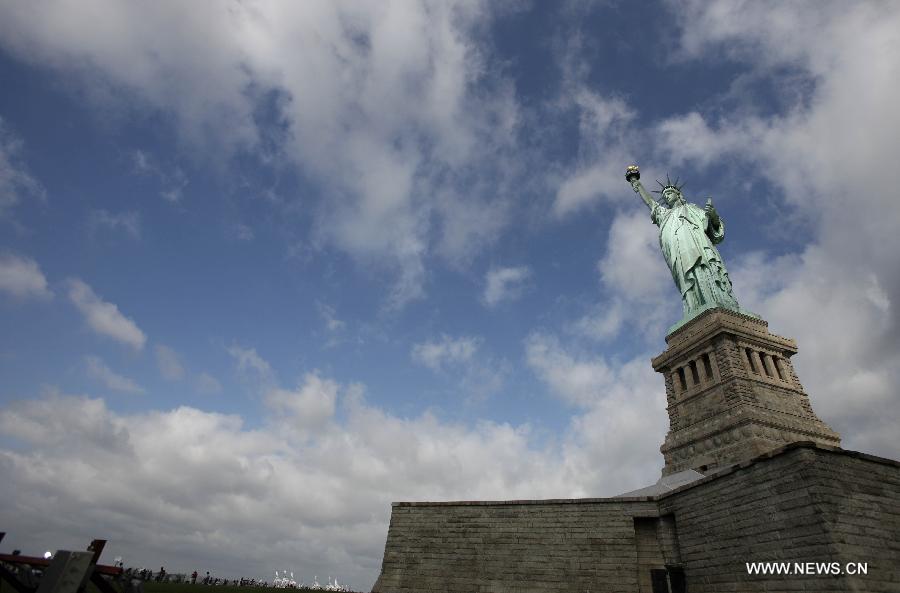 The Statue of Liberty is seen on the Liberty Island in New York, the United States, on July 4, 2013, the U.S. Independence Day. The Statue of Liberty and Liberty Island reopened to the public on Thursday for the first time since Hurricane Sandy made landfall on Oct. 29, 2012. (Xinhua/Cheng Li) 
