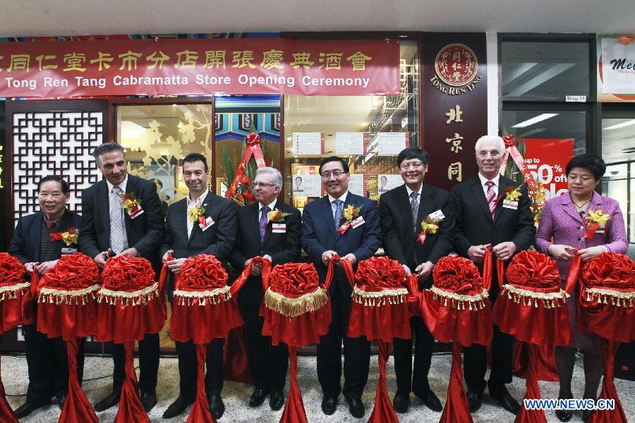 Chinese Consul-General Li Huaxin(4th R) cuts the ribbon with the other guests at the opening ceremony of the Beijing Tong Ren Tang Cabramatta Store, southeast of Sydney, Australia, on July 5, 2013. Beijing Tong Ren Tang Cabramatta Store opened on July 5, 2013, the fourth store in Australia following the stores in Sydney CBD in 2005,, Brisbane in 2008 and Chatswood, north of Sydney in 2011. Australia legalized traditional Chinese medicine in 2012. Beijing TRT founded in 1669 is a famous time-honored brand in traditional Chinese medicine industry. (Xinhua/Jin Linpeng)