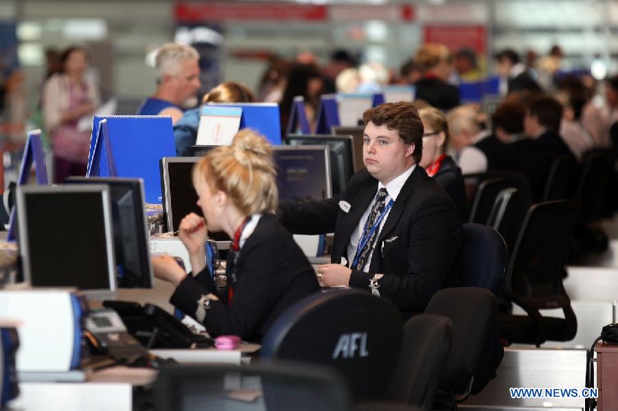 Ground staff of an airline work at a check-in counter in Terminal D at Moscow's Sheremetyevo International Airport, Russia, July 5, 2013. Snowden, via his legal advisor Sarah Harrison from WikiLeaks, earlier this week handed over an asylum request to Russian authorities but withdrew it later. He fled to Moscow from Hong Kong and has reportedly stayed since June 23 in the transit area of Moscow's Sheremetyevo airport. (Xinhua/Liu Yiran)