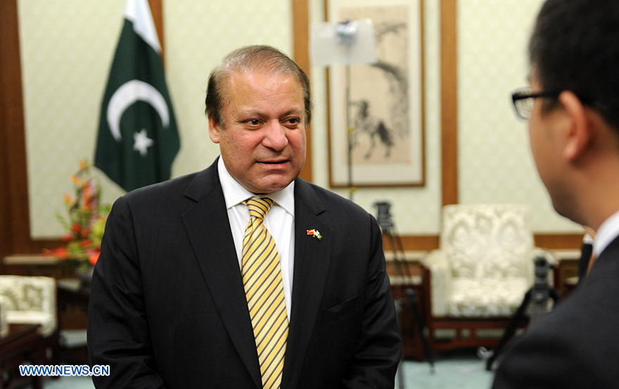Pakistani Prime Minister Nawaz Sharif (L) gives an exclusive interview to Xinhuanet in Beijing, July 5, 2013. (Xinhuanet Photo)