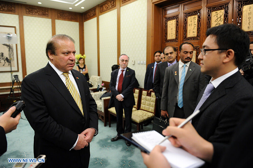 Pakistani Prime Minister Nawaz Sharif (L) gives an exclusive interview to Xinhuanet in Beijing, July 5, 2013. (Xinhuanet Photo)