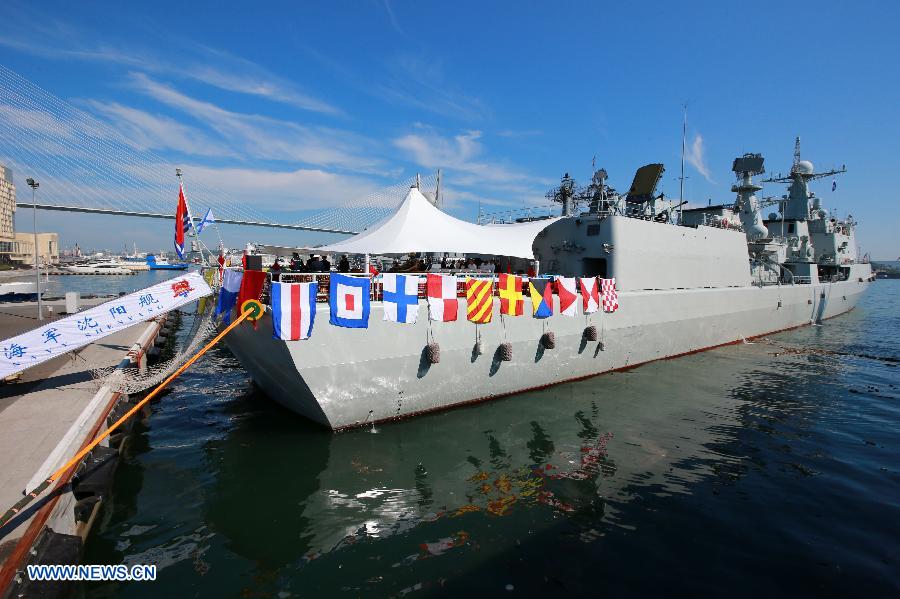 Photo taken on July 6, 2013 shows a Chinese Navy vessel at the port in Vladivostok, Russia. The Chinese Navy Shijiazhuang guided-missile destroyer, which is participating in the "Joint Sea-2013" joint naval drills of China and Russia, opened to the public and Russian navy soldiers on Saturday. (Xinhua/Zha Chunming)