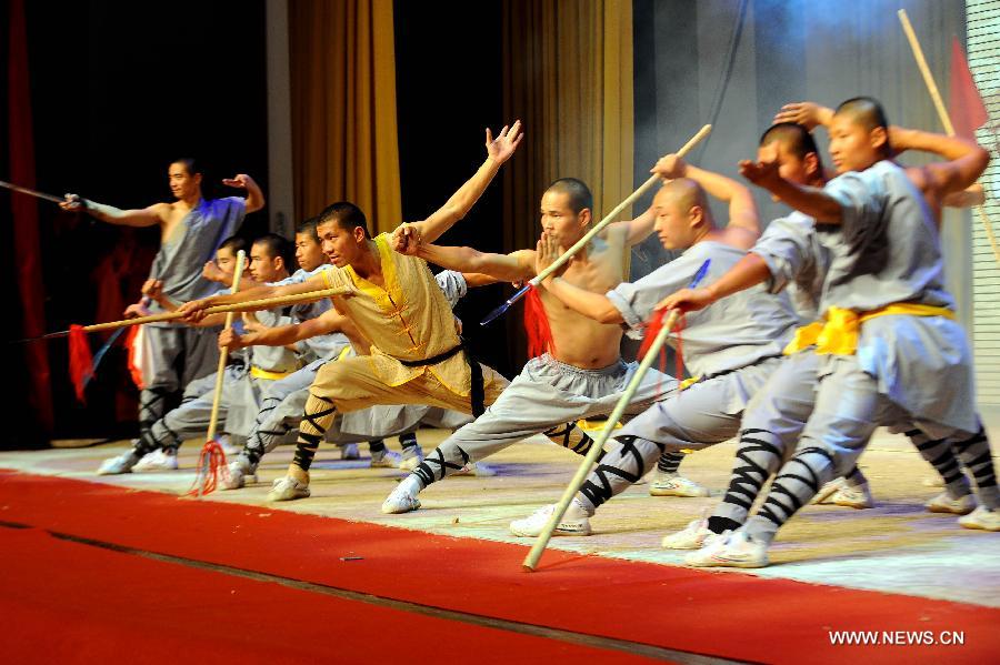 Performers of the Yandong Shaolin Kungfu troupe show their Kungfu during a performance held at the Worker's Cultural Palace, Taiyuan, capital of north China's Shanxi Province, July 6, 2013. The martial art troupe have their performers trained in the renowned Shaolin Temple, and staged performances worldwide in the hope of promoting Shaolin-style martial arts and Chinese culture. (Xinhua/Fan Minda) 