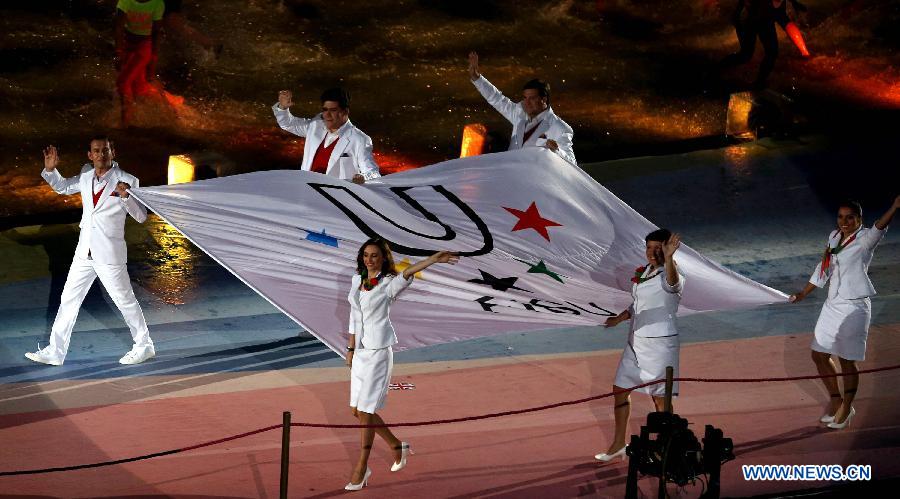 The flag of International University Sports Federation is carried into the stadium during the opening ceremony of the Summer Universiade in Kazan, Russia, July 6, 2013. (Xinhua/Li Ying) 