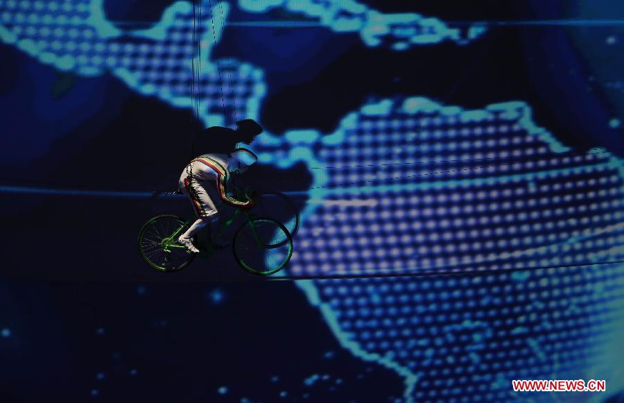 An artist performs during the opening ceremony of the Summer Universiade in Kazan, Russia, July 6, 2013. (Xinhua/Meng Yongmin) 