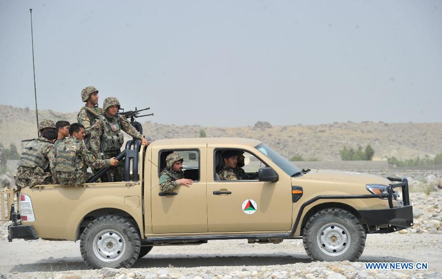 Afghan army soldiers patrol with their military vehicles during an operation against Taliban in Laghman province in eastern of Afghanistan on July 7, 2013. At least five Taliban fighters killed by Afghan army soldiers during an operation in Laghman province on Sunday Army officials said. (Xinhua/Tahir Safi)