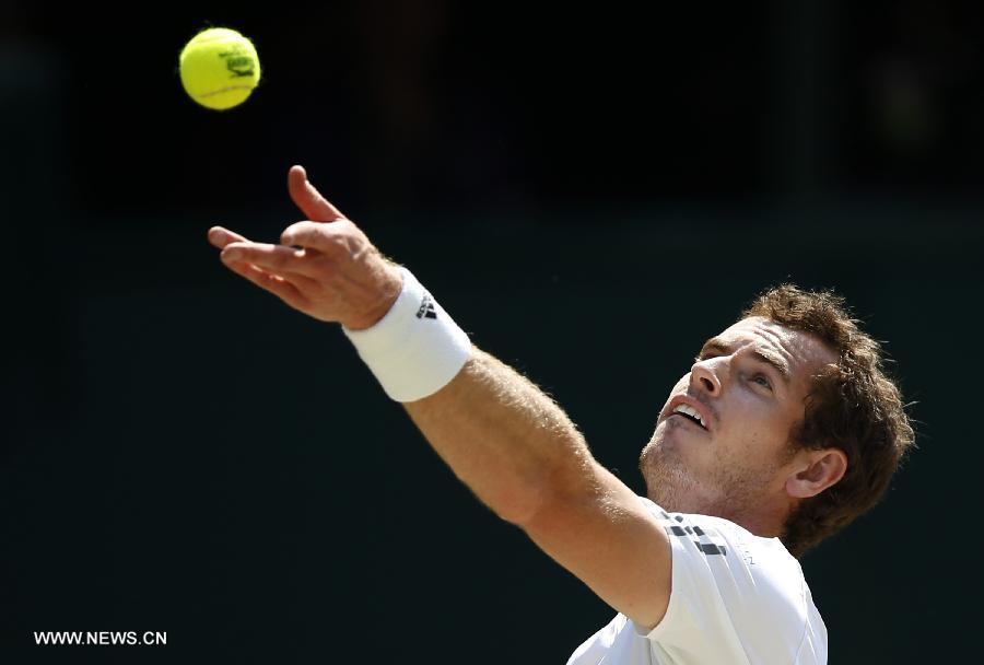 Andy Murray of Great Britain competes during the final of gentlemen's singles against Novak Djokovic of Serbia on day 13 of the Wimbledon Lawn Tennis Championships at the All England Lawn Tennis and Croquet Club in London, Britain, on July 7, 2013. (Xinhua/Wang Lili)