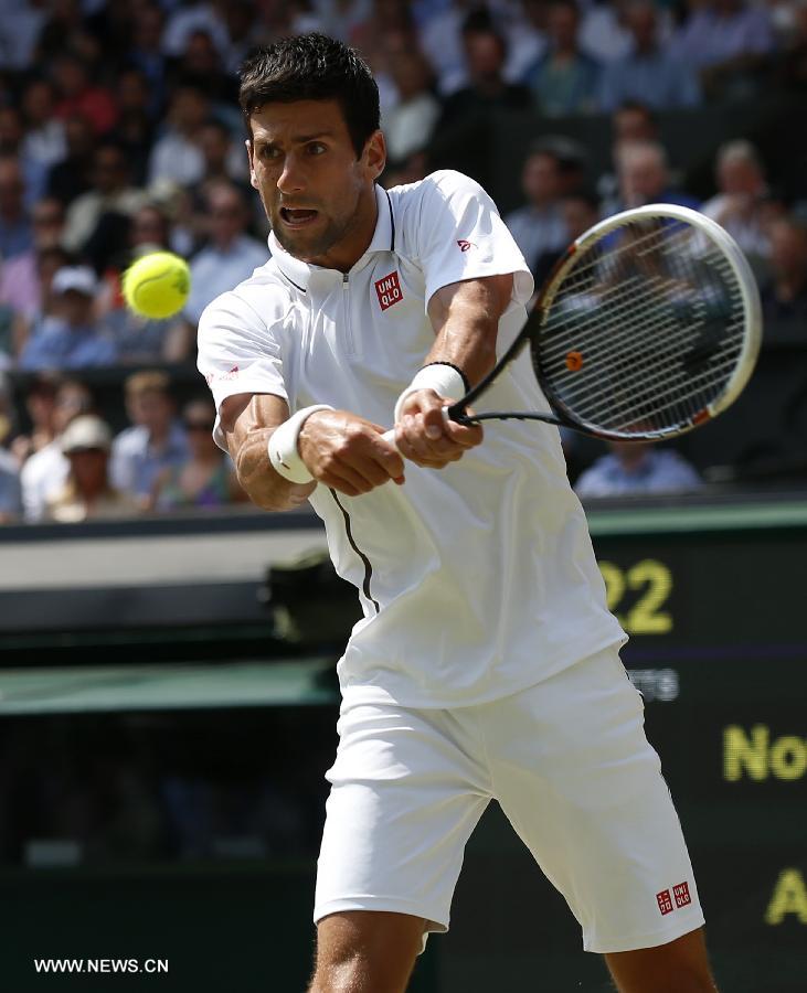 Novak Djokovic of Serbia competes during the final of gentlemen's singles against Andy Murray of Great Britain on day 13 of the Wimbledon Lawn Tennis Championships at the All England Lawn Tennis and Croquet Club in London, Britain, on July 7, 2013. (Xinhua/Wang Lili)