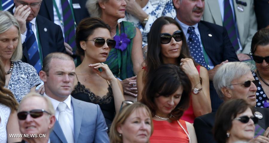 Victoria Caroline Beckham (5th L), an English businesswoman, fashion designer, model and singer, watches in the royal box the final of gentlemen's singles between Novak Djokovic of Serbia and Andy Murray of Great Britain on day 13 of the Wimbledon Lawn Tennis Championships at the All England Lawn Tennis and Croquet Club in London, Britain on July 7, 2013. (Xinhua/Wang Lili)