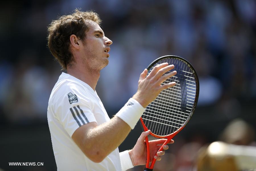 Andy Murray of Great Britain reacts during the final of gentlemen's singles against Novak Djokovic of Serbia on day 13 of the Wimbledon Lawn Tennis Championships at the All England Lawn Tennis and Croquet Club in London, Britain, on July 7, 2013. (Xinhua/Wang Lili)