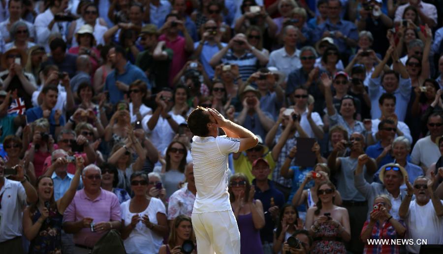 Andy Murray of Britain celebrates after winning the men's singles final match with Novak Djokovic of Serbia on day 13 of the Wimbledon Lawn Tennis Championships at the All England Lawn Tennis and Croquet Club in London, Britain, July 7, 2013. Andy Murray won his first Wimbledon title and ended Britain's 77-year wait for a men's champion with a 6-4 7-5 6-4 victory over world number one Novak Djokovic. (Xinhua/Wang Lili)
