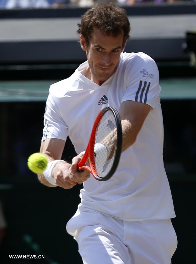 Andy Murray of Great Britain competes during the final of gentlemen's singles against Novak Djokovic of Serbia on day 13 of the Wimbledon Lawn Tennis Championships at the All England Lawn Tennis and Croquet Club in London, Britain, on July 7, 2013. (Xinhua/Wang Lili)