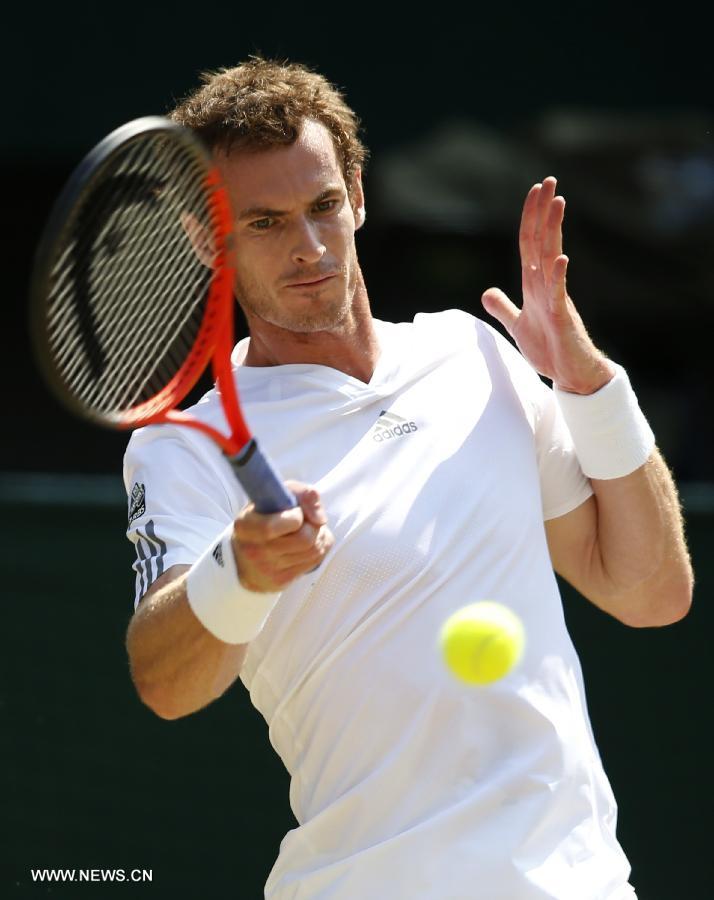 Andy Murray of Great Britain competes during the final of gentlemen's singles against Novak Djokovic of Serbia on day 13 of the Wimbledon Lawn Tennis Championships at the All England Lawn Tennis and Croquet Club in London, Britain, on July 7, 2013. (Xinhua/Wang Lili)