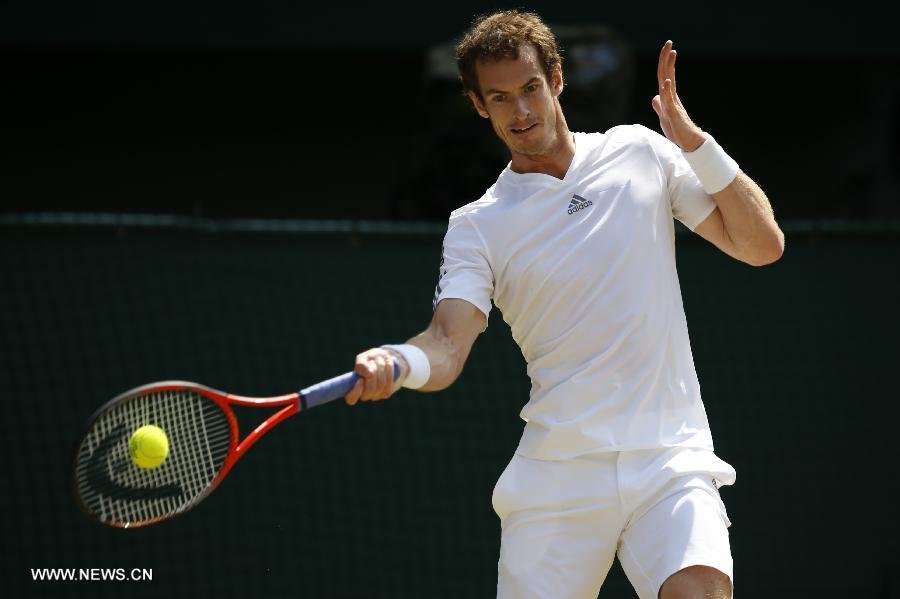 Andy Murray of Great Britain competes during the final of gentlemen's singles against Novak Djokovic of Serbia on day 13 of the Wimbledon Lawn Tennis Championships at the All England Lawn Tennis and Croquet Club in London, Britain, on July 7, 2013. (Xinhua/Wang Lili)