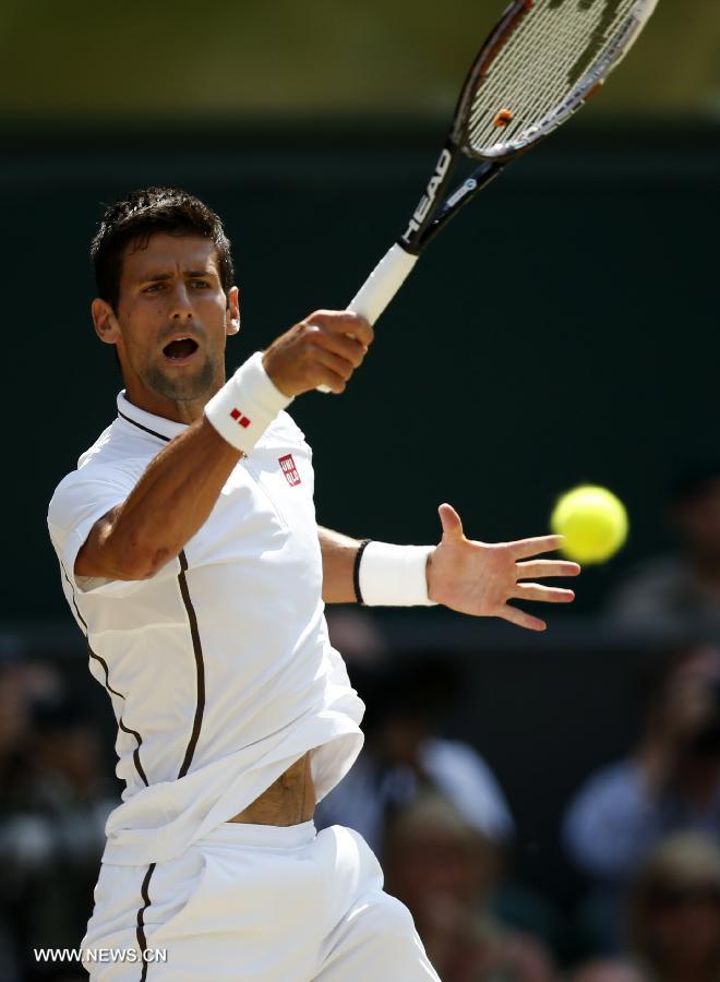 Novak Djokovic of Serbia competes during the final of gentlemen's singles against Andy Murray of Great Britain on day 13 of the Wimbledon Lawn Tennis Championships at the All England Lawn Tennis and Croquet Club in London, Britain, on July 7, 2013. (Xinhua/Wang Lili)