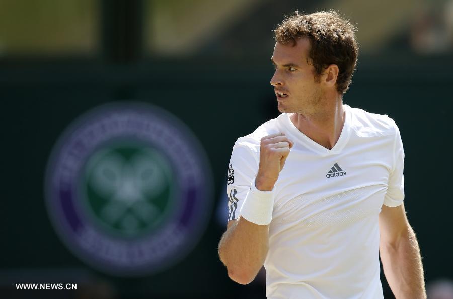 Andy Murray of Great Britain celebrates during the final of gentlemen's singles against Novak Djokovic of Serbia on day 13 of the Wimbledon Lawn Tennis Championships at the All England Lawn Tennis and Croquet Club in London, Britain, on July 7, 2013. (Xinhua/Wang Lili)