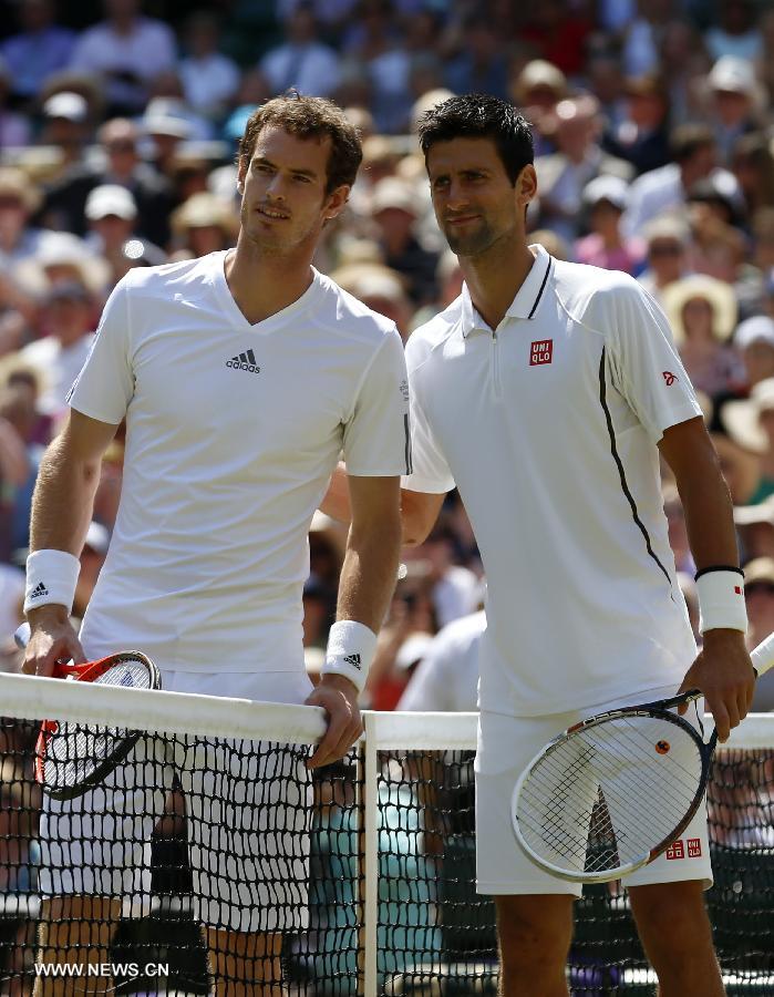 Novak Djokovic (R)of Serbia and Andy Murray of Great Britain pose for photos ahead of their final of gentlemen's singles on day 13 of the Wimbledon Lawn Tennis Championships at the All England Lawn Tennis and Croquet Club in London, Britain on July 7, 2013. (Xinhua/Wang Lili)