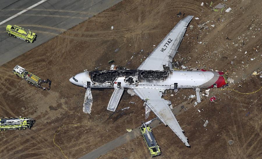 An aerial view of an Asiana Airlines Boeing 777 plane is seen after it crashed while landing at San Francisco International Airport in California on July 6, 2013. Two people were killed and 130 were hospitalized after the plane crash-landed at San Francisco International Airport on Saturday morning, San Francisco Fire Department Chief Joanna Hayes-White said. The figures cited by Hayes-White leave 69 people still unaccounted for in the accident. The Boeing 777, which had flown from Seoul, South Korea, was carrying 307 people. (Xinhua/Reuters Photo)