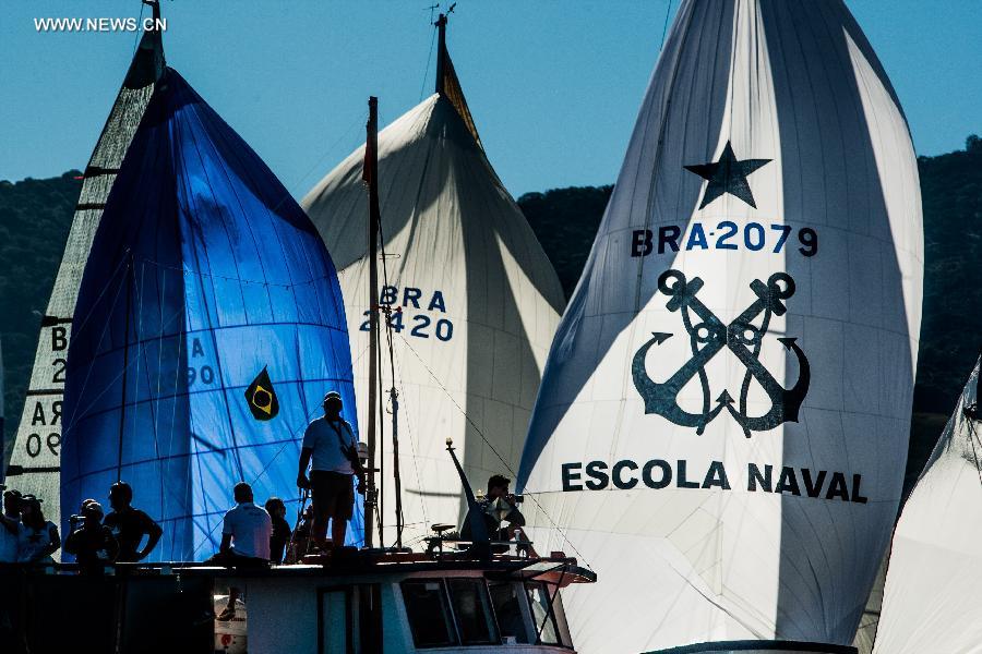 Competitors compete in the Rolex Ilhabela Sailing Week 2013, held in the Ilhabela Yacht Club, in Ilhabela, Brazil, on July 7, 2013. The Ilhabela Sailing Week is the greatest oceanic boat race in Latin America, with more than 150 inscribed boats and teams from more than 8 countries. Brazilian Olympic medalist and world champion of the Round the World race, Torben Grael, leads the competition until now. (Xinhua/Marcos Mendez)