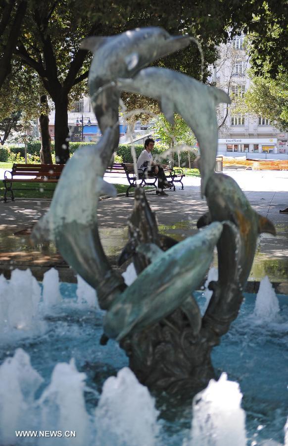 A man sits in the Gezi park in Istanbul on July 8, 2013. Turkey's Gezi Park was opened to the public Monday after a week-long closure, Istanbul Governor Huseyin Avni Mutlu announced. (Xinhua/Lu Zhe) 