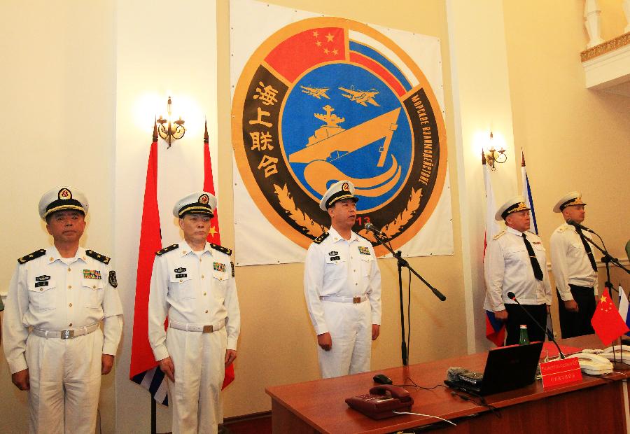 Ding Yiping, deputy commander of the Chinese Navy, announces the subject and content of the joint naval drills in Vladivostok, Russia, July 8, 2013. China and Russia started on Monday the joint naval drills off the coast of Russia's Far East. (Xinhua/Zha Chunming)