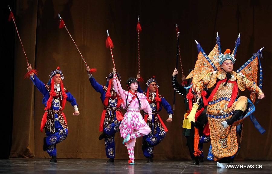 Chinese artists perform Beijing Opera at the National Theater in Algiers, capital of Algeria, July 8, 2013. The performance was part of the celebrations to mark the 55th anniversary of the establishment of the diplomatic relations between China and Algeria. (Xinhua/Mohamed Kadri)