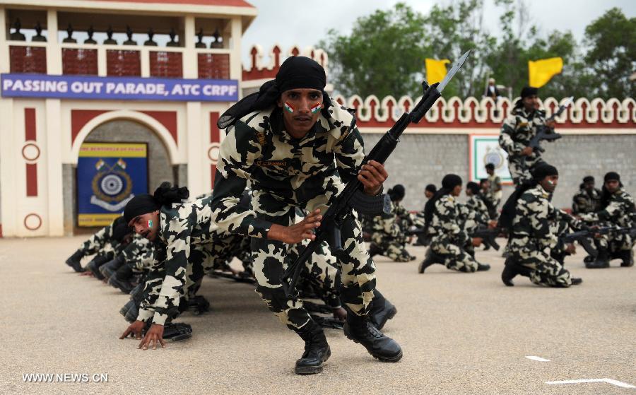 Central Reserve Police Force (CRPF) personnels participate in an arms drill during the passing-out parade of 945 recruits in Bangalore, India, on July 9, 2013. (Xinhua/Stringer) 