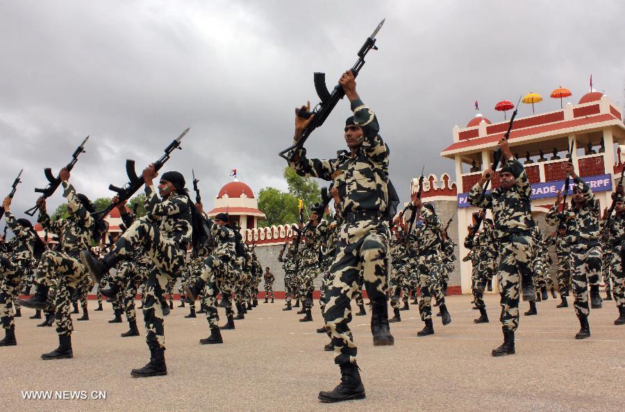 Central Reserve Police Force (CRPF) personnels participate in an arms drill during the passing-out parade of 945 recruits in Bangalore, India, on July 9, 2013. (Xinhua/Stringer) 