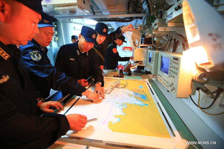 Chinese Navy fleet commander Wang Dazhong (3rd L) attends the "Joint Sea-2013" drill at Peter the Great Bay in Russia, July 9, 2013. Chinese and Russian warships carried out a variety of exercises including joint air defense, maritime supply, joint escort and the rescue of hijacked vessels during the second day of "Joint Sea-2013" drill. (Xinhua/Zha Chunming)