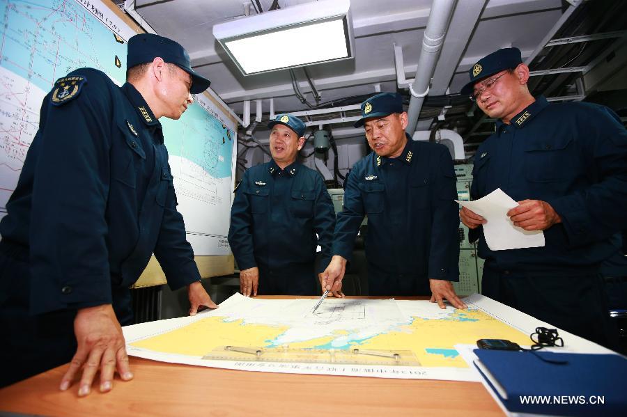 Commanders of Chinese Navy fleet attend the "Joint Sea-2013" drill at Peter the Great Bay in Russia, July 9, 2013. Chinese and Russian warships carried out a variety of exercises including joint air defense, maritime supply, joint escort and the rescue of hijacked vessels during the second day of "Joint Sea-2013" drill. (Xinhua/Zha Chunming)