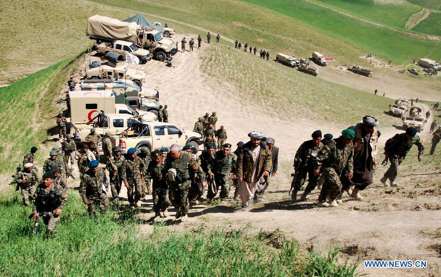 Afghan army officers and soldiers are seen during an operation against Taliban fighters in Badakhshan province in northeast Afghanistan on July 9, 2013. 38 Taliban militants have been killed in security operations across Afghanistan within the last 24 hours, said the country's Interior Ministry Tuesday morning. (Xinhua/Azorda)