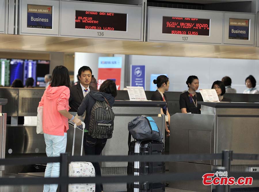 Asiana Airlines' flights to Beijing at San Francisco International Airport are back to normal on July 8, 2013, after the airport re-opens some international airlines. Due to a deadly crash on July 6, the airport was completely closed for all approaching and departing flights. Two Chinese schoolgirls were killed and 182 passengers injured in the crash. (Photo: crienglish/CNS)
