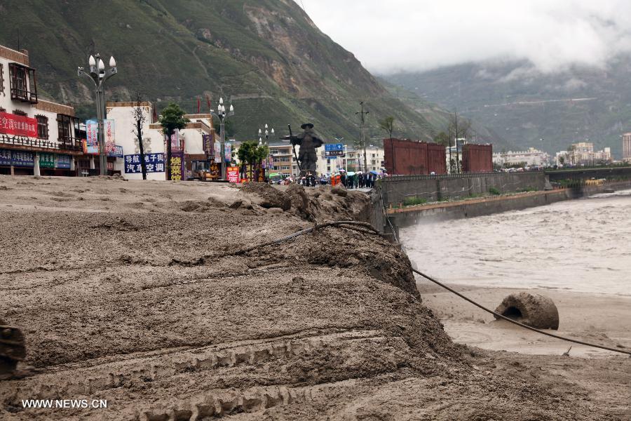 A road is destroyed by rainstorm-triggered landslide in Wenchuan County, southwest China's Sichuan Province, July 10, 2013. Rainstorms battered the county in these two days. (Xinhua/Lu Guotong)