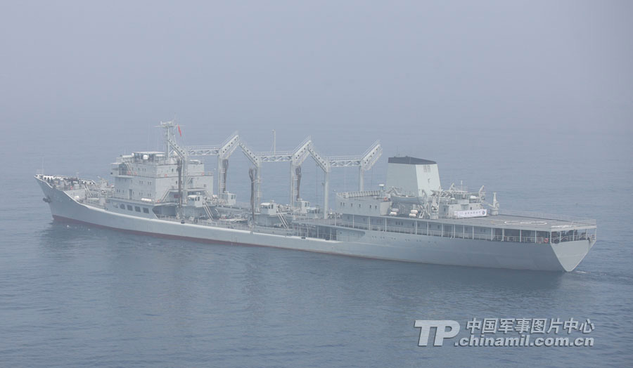 Chinese and Russian warships participating in the China-Russia "Joint Sea-2013" joint naval drill conduct joint escort drill in a designated exercise sea area on July 9, 2013. (China Military Online/Sun Yang) 