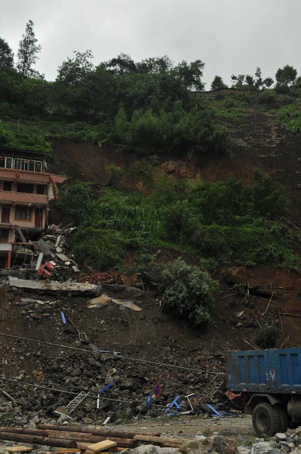 Photo taken on July 10, 2013 shows the site where a cave-in occurred at a martyrs' park near Baoxing Middle School in Baoxing County, southwest China's Sichuan Province. No casualties were reported. (Xinhua/Wang Jun)