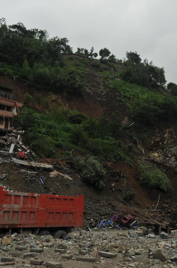 Photo taken on July 10, 2013 shows the site where a cave-in occurred at a martyrs' park near Baoxing Middle School in Baoxing County, southwest China's Sichuan Province. No casualties were reported. (Xinhua/Wang Jun)